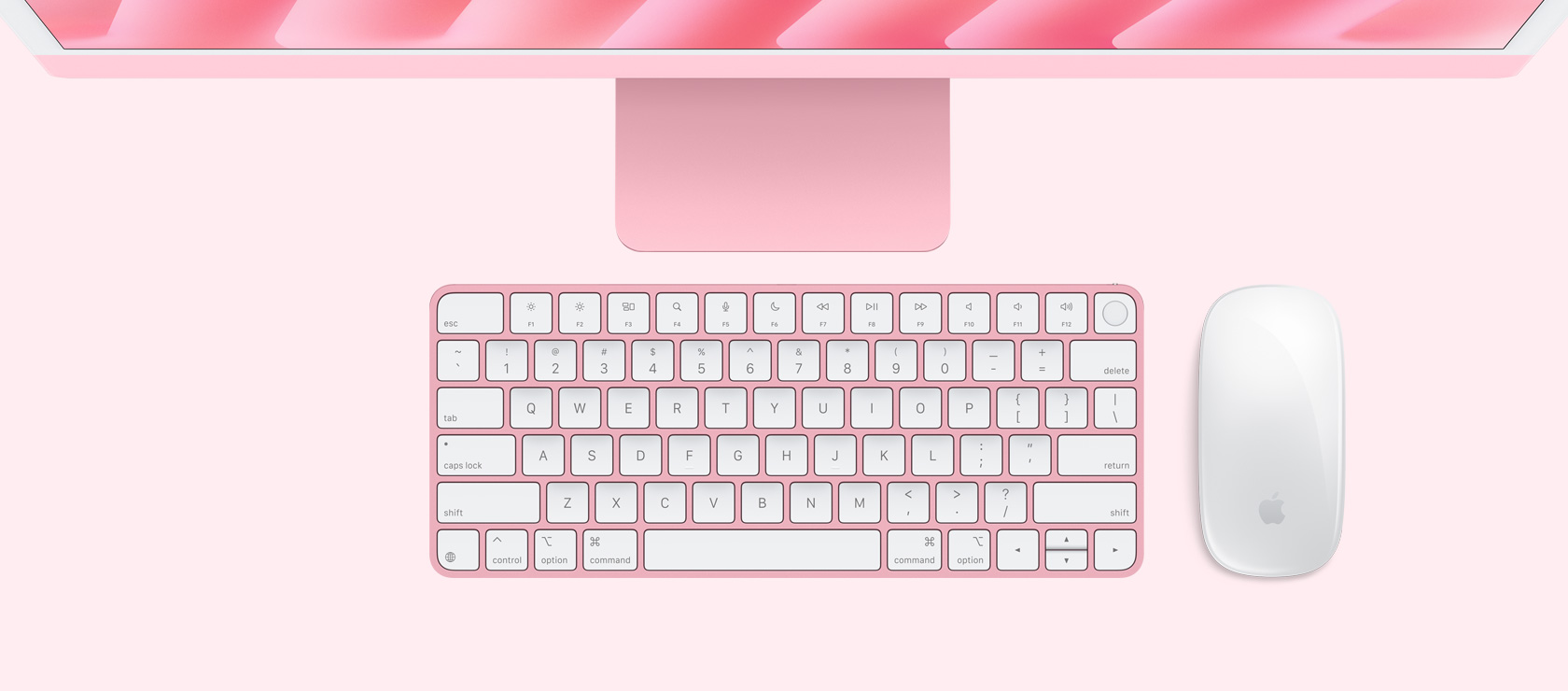 Overhead view of pink iMac with colour-matching mouse and keyboard
