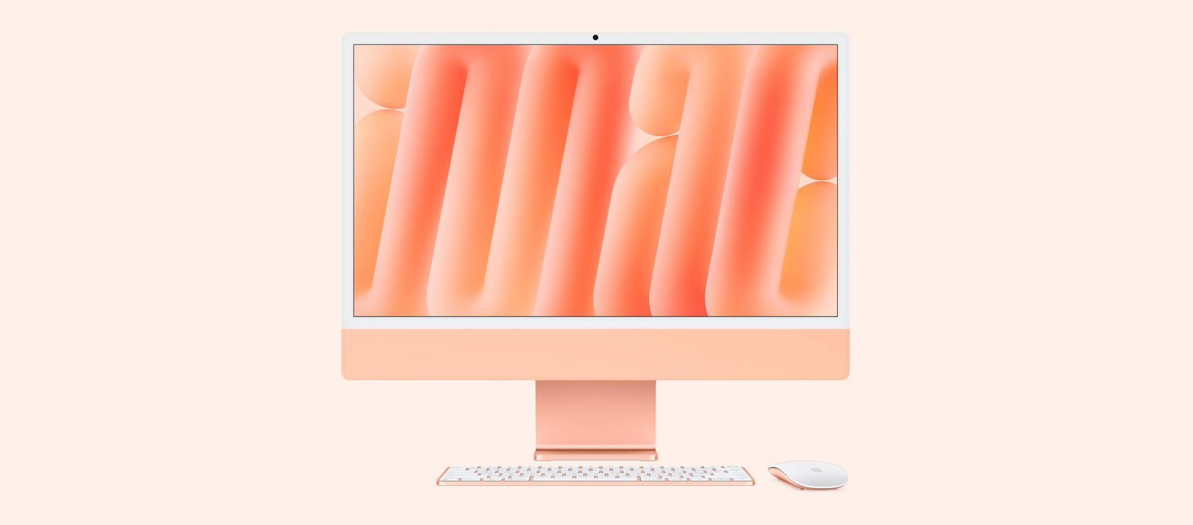 Front view of orange iMac with colour-matching mouse and keyboard