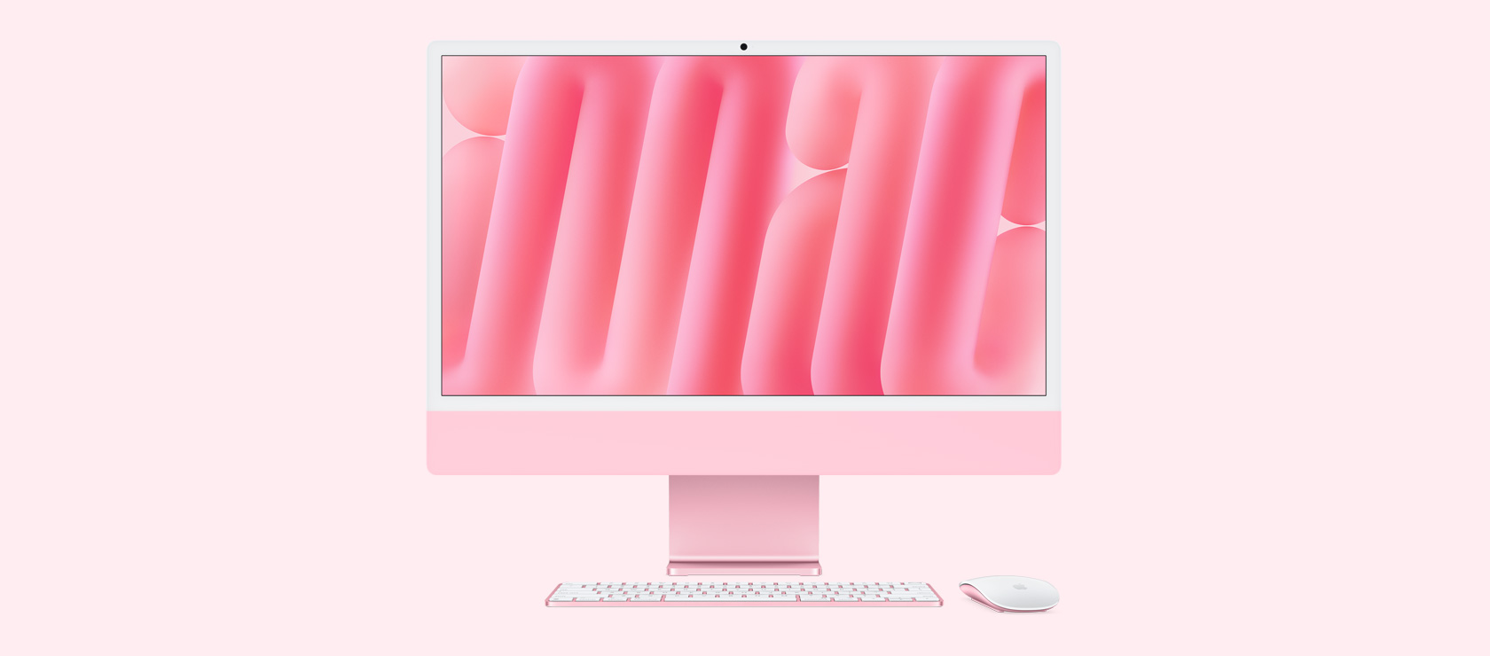 Front view of pink iMac with colour-matching mouse and keyboard